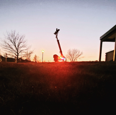 Apollo electric scooter parked at sunset after a summer ride, cooling down before charging