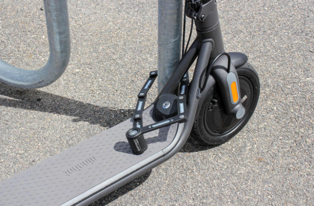 Folding e-scooter lock used to prevent scooter theft