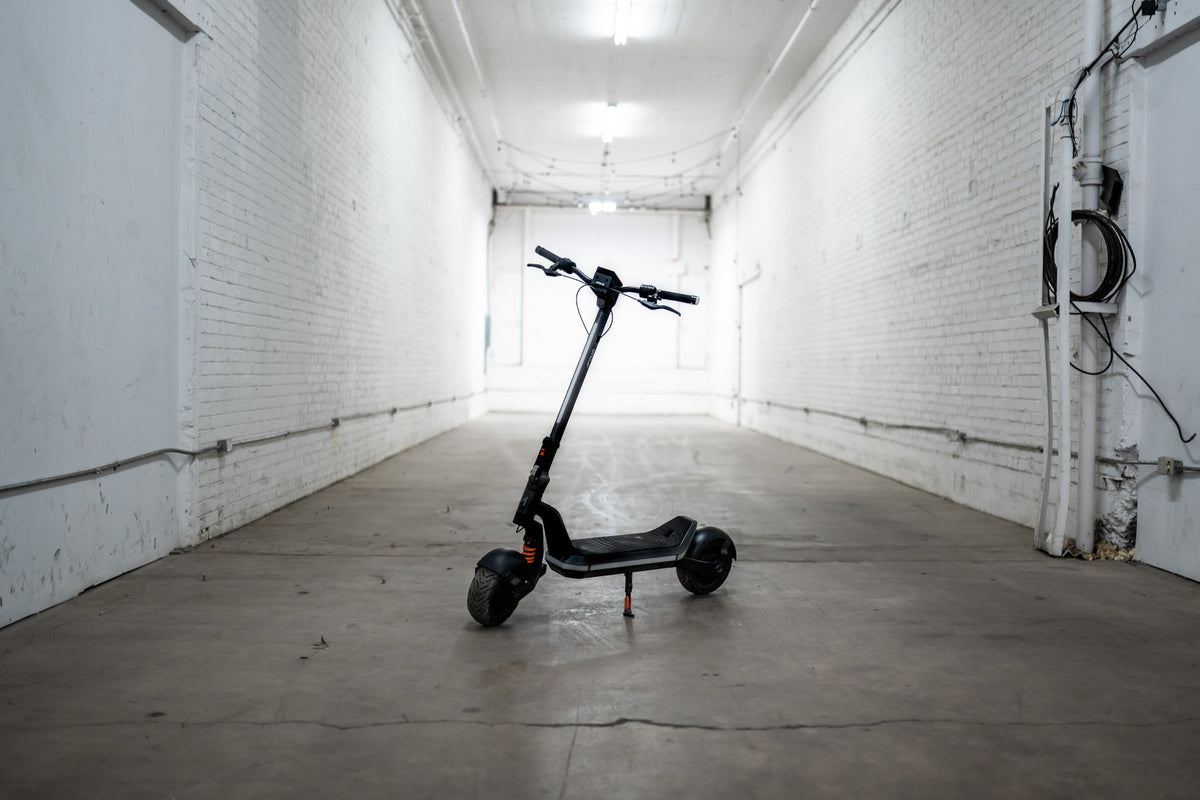 The Apollo Phantom 2.0 (52V) electric scooter parked inside, showcasing its modern design.