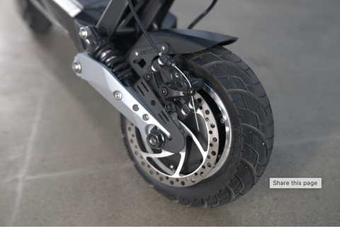 zoomed-in shot of the tire wheel of the Apollo Ghost e-scooter
