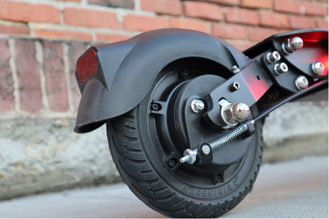 rear right angle view of the rear wheel of the EMOVE Touring e-scooter which uses a solid tire