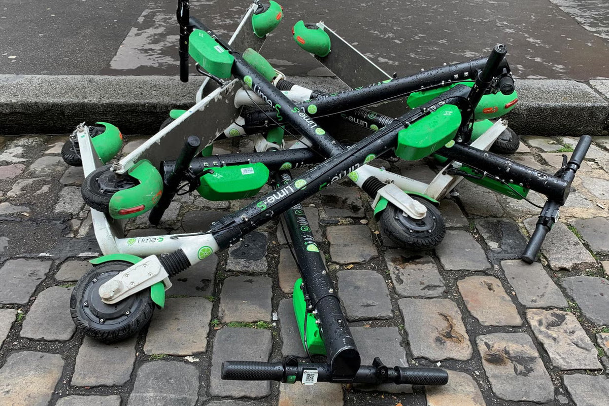 A pile of abandoned lime scooters