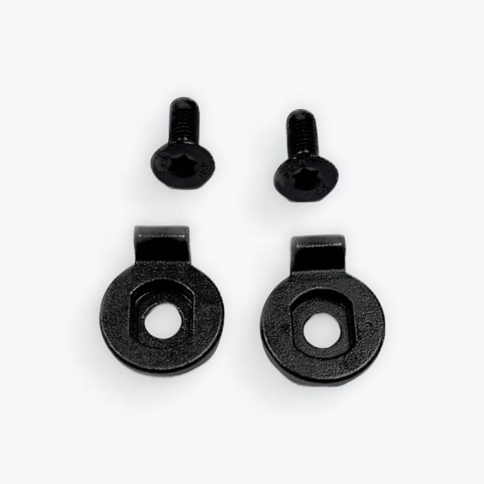 Set of black metal screws and washers on a white background