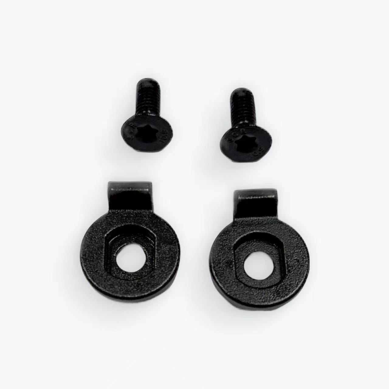 Set of black metal screws and washers on a white background